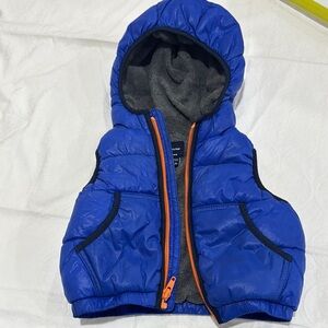 Blue Hooded Puffer Vest with Orange Zipper